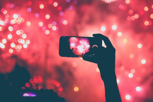 taking a picture of fireworks