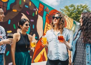 moderate drinking women talking and holding beer