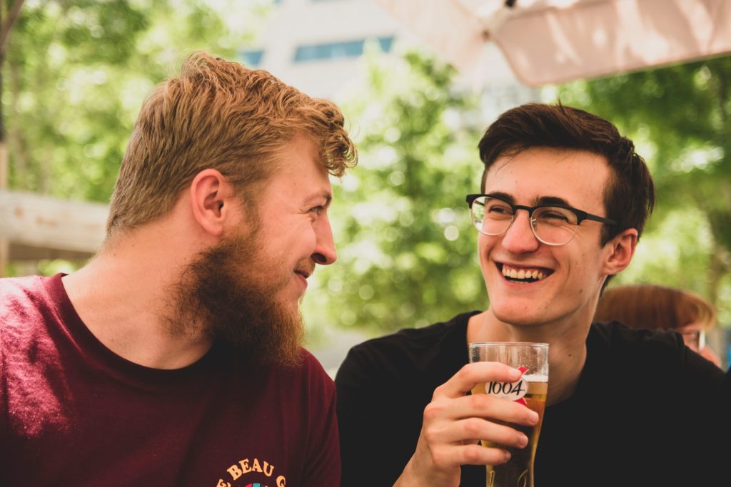 moderate drinking two friends sharing a beer