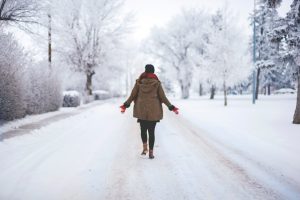 dry january benefits woman walking in the snow
