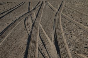 tire tracks winding through the sand sneaky things that can undermine you
