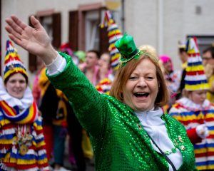 woman in green at parade st patricks day sober