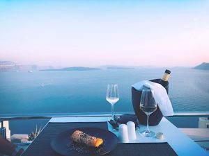 dating an alcoholic, two wine glasses overlooking water