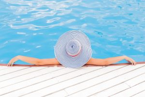 woman relaxing in pool, rehab from home