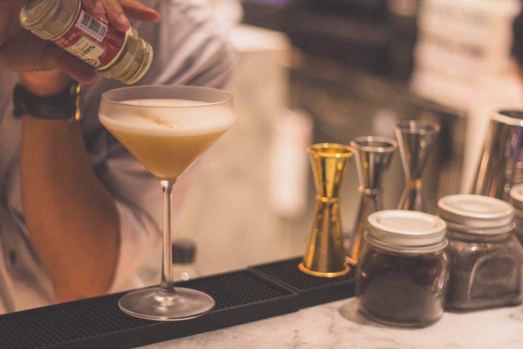 alcohol use survey, bartender mixing drinks