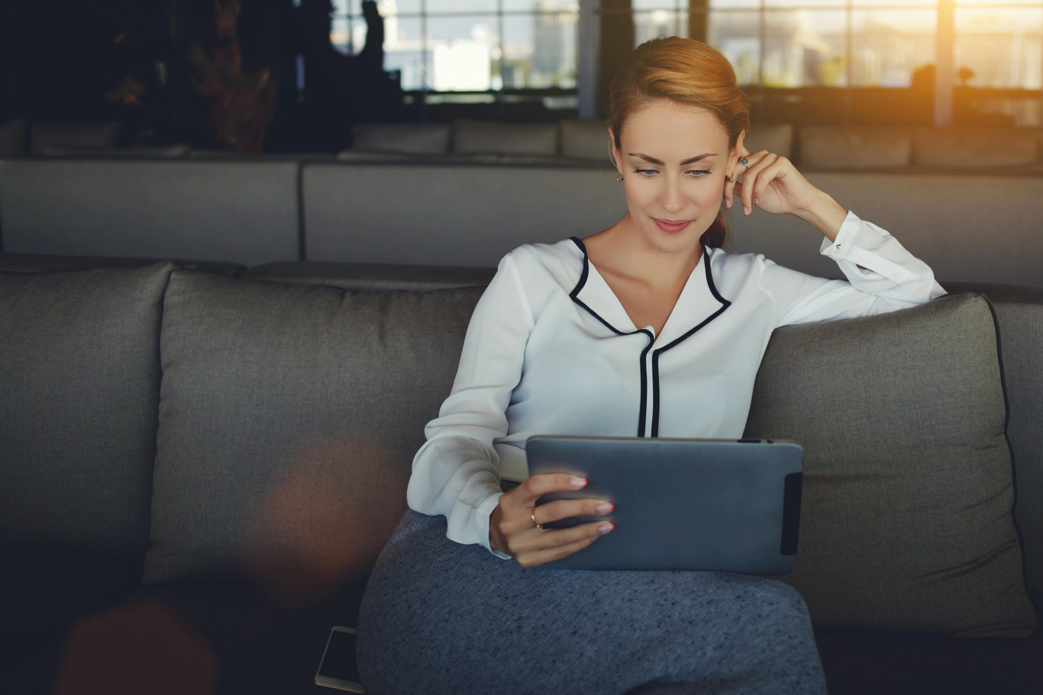 woman watching video on tablet, Ria Health