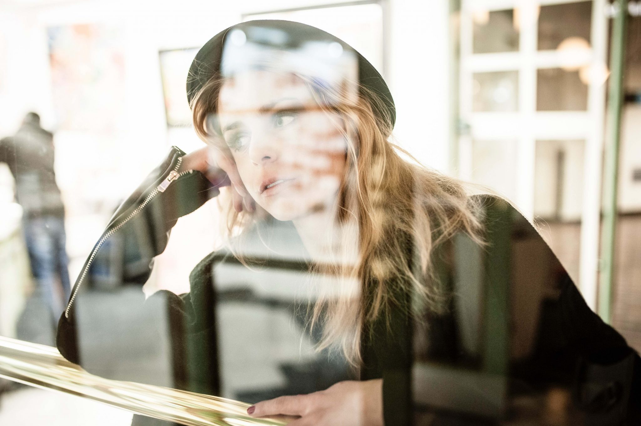 woman by window how to stop using alcohol as a crutch