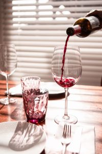pouring wine, early signs of liver damage from alcohol
