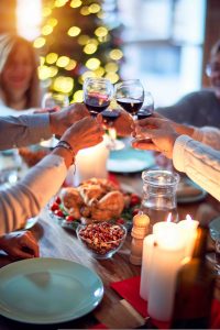family toasting glasses, coping with family drinking at holiday gatherings
