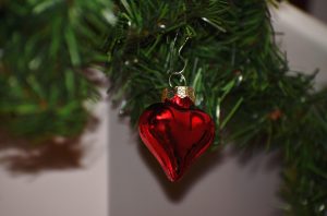 heart ornament on tree, holiday heart syndrome
