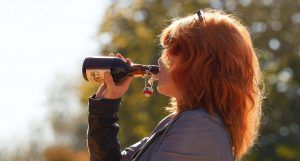woman drinking beer maladaptive behavior