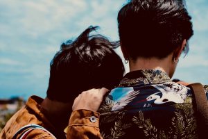 couple looking over the sea, getting sober in a relationship