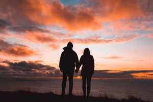 couple watching sunset, getting sober in a relationship