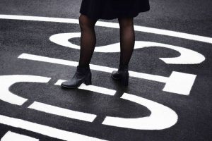 woman standing over stop sign, diarrhea after drinking alcohol