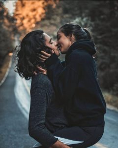 couple kissing in street, alcohol and sex