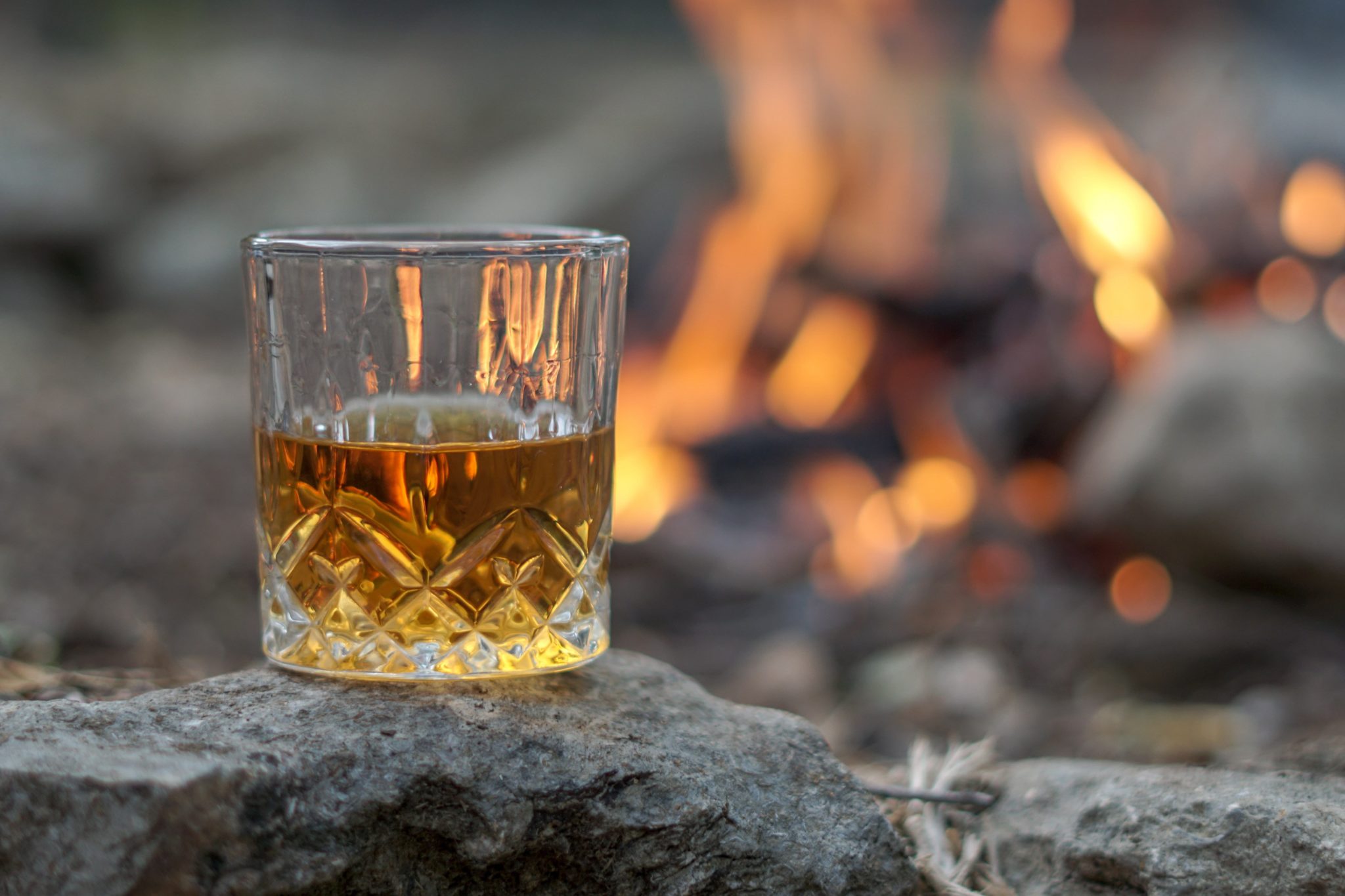 whiskey in glass by the fire, can you drink whiskey every day