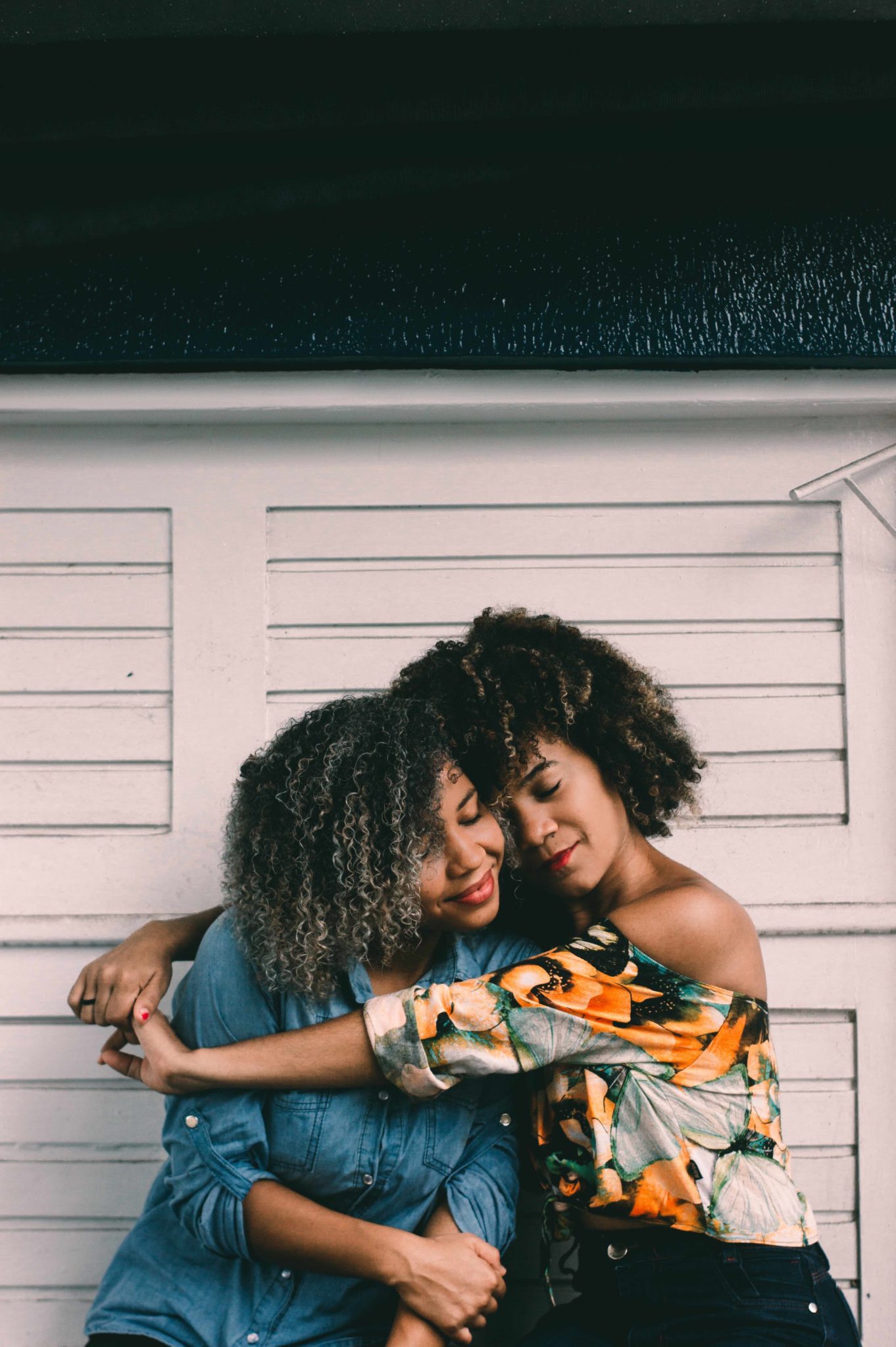 women hugging each other, self care in recovery