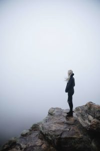 woman overlooking grey landscape treating anxiety and alcohol addiction