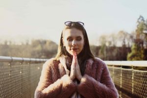 woman practicing mindfulness while taking a walk