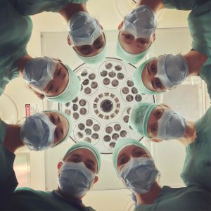 doctors gathered around an operating table