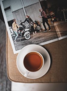 cup of tea and magazine on table