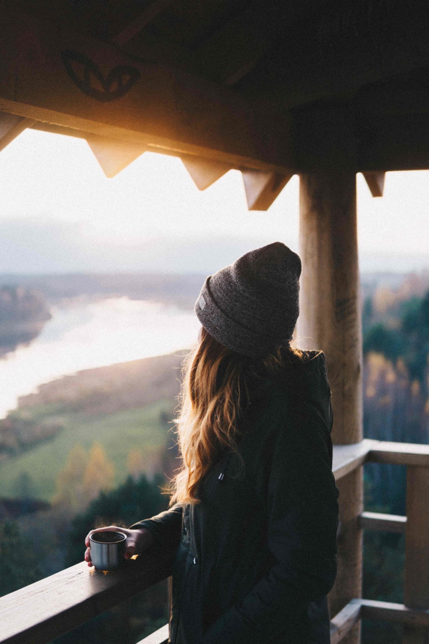 woman with coffee on a balcony