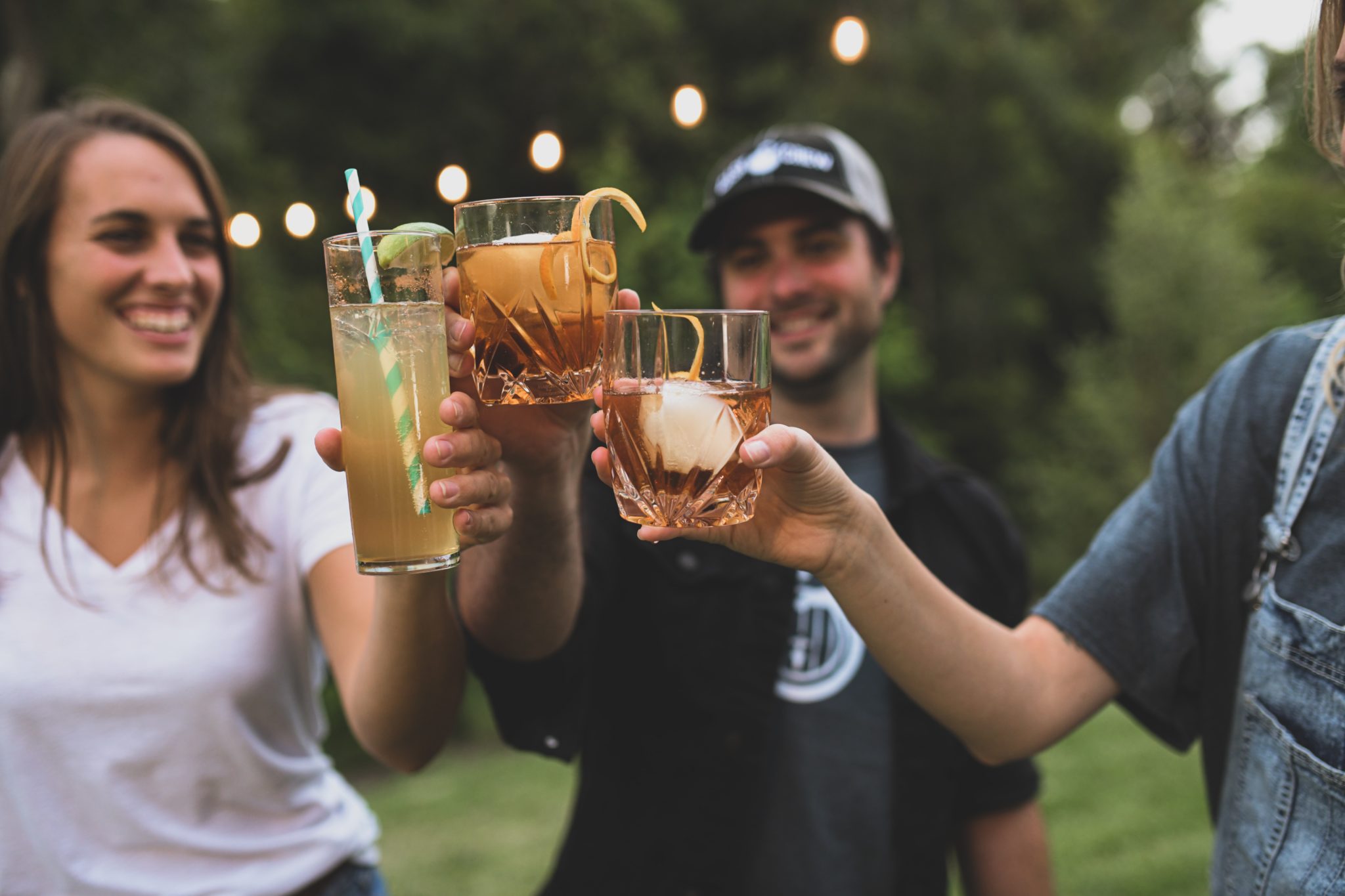 friends raising glasses outdoors