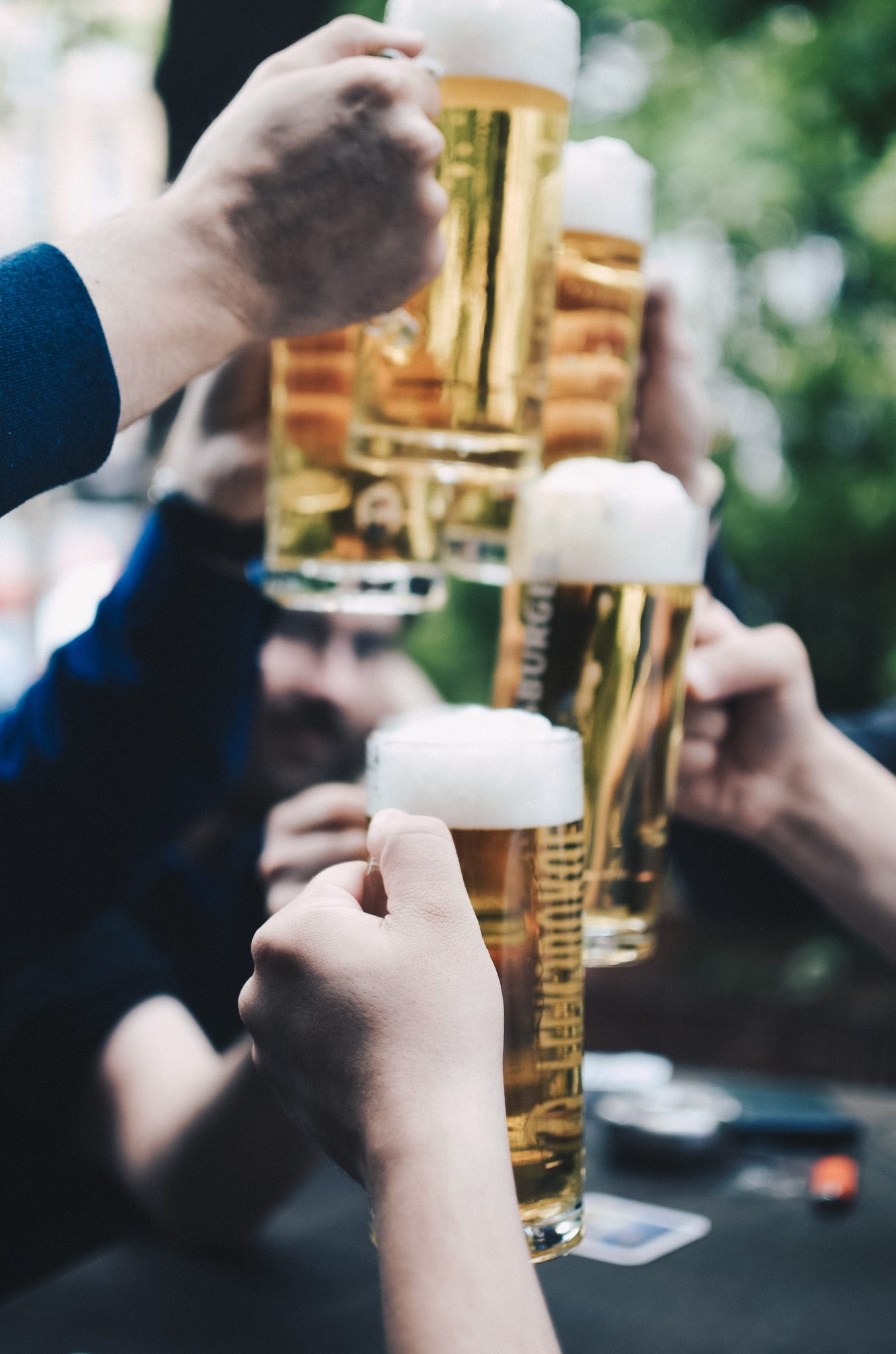 glasses of beer raised in a toast