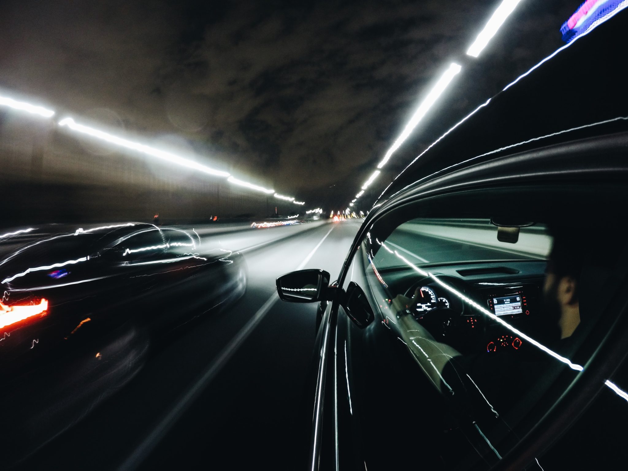 fast cars driving through tunnel risky driving