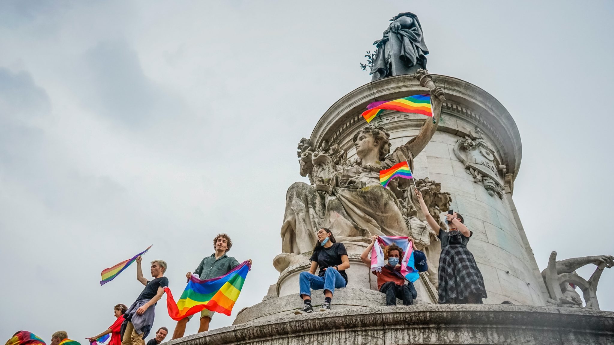 pride march and flags public monument