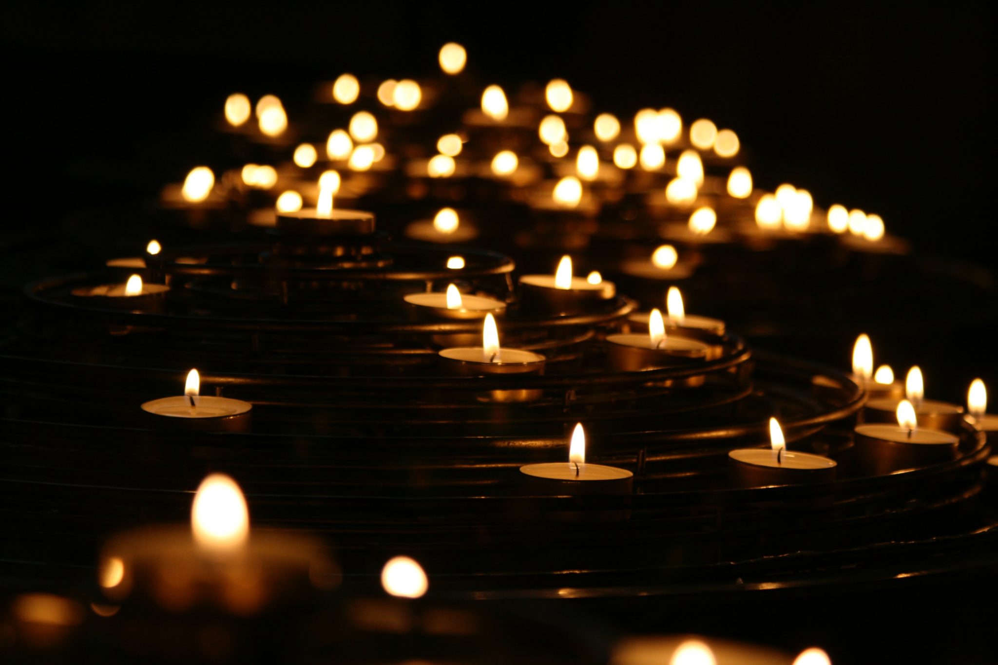 candles on a dark background grieving