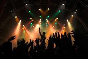 Singer in front of a large crowd