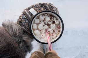 peppermint hot chocolate mug in the snow