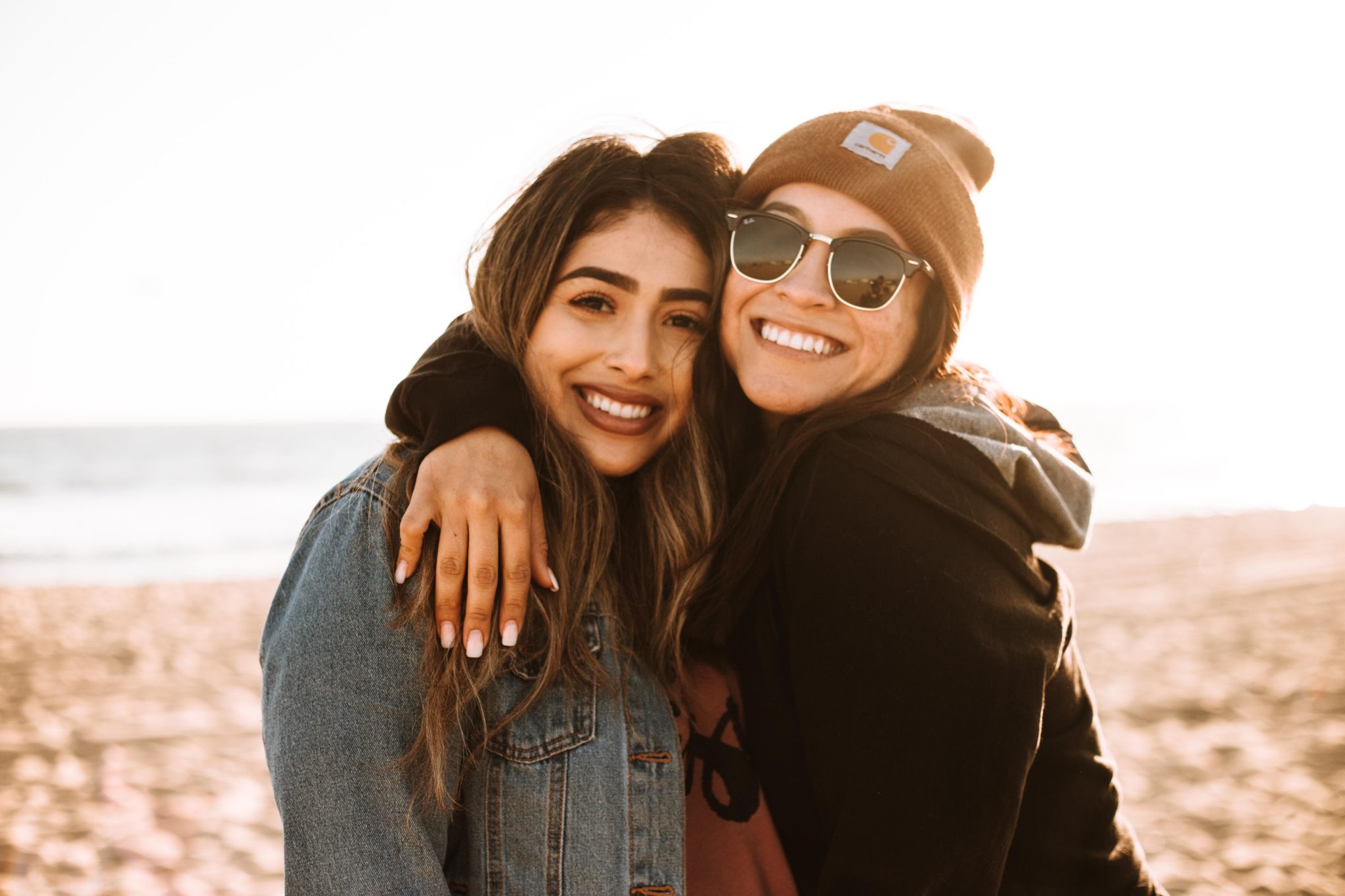 two women embracing, supporting each other