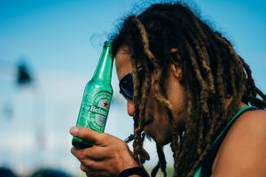 man drinking beer and using thc product