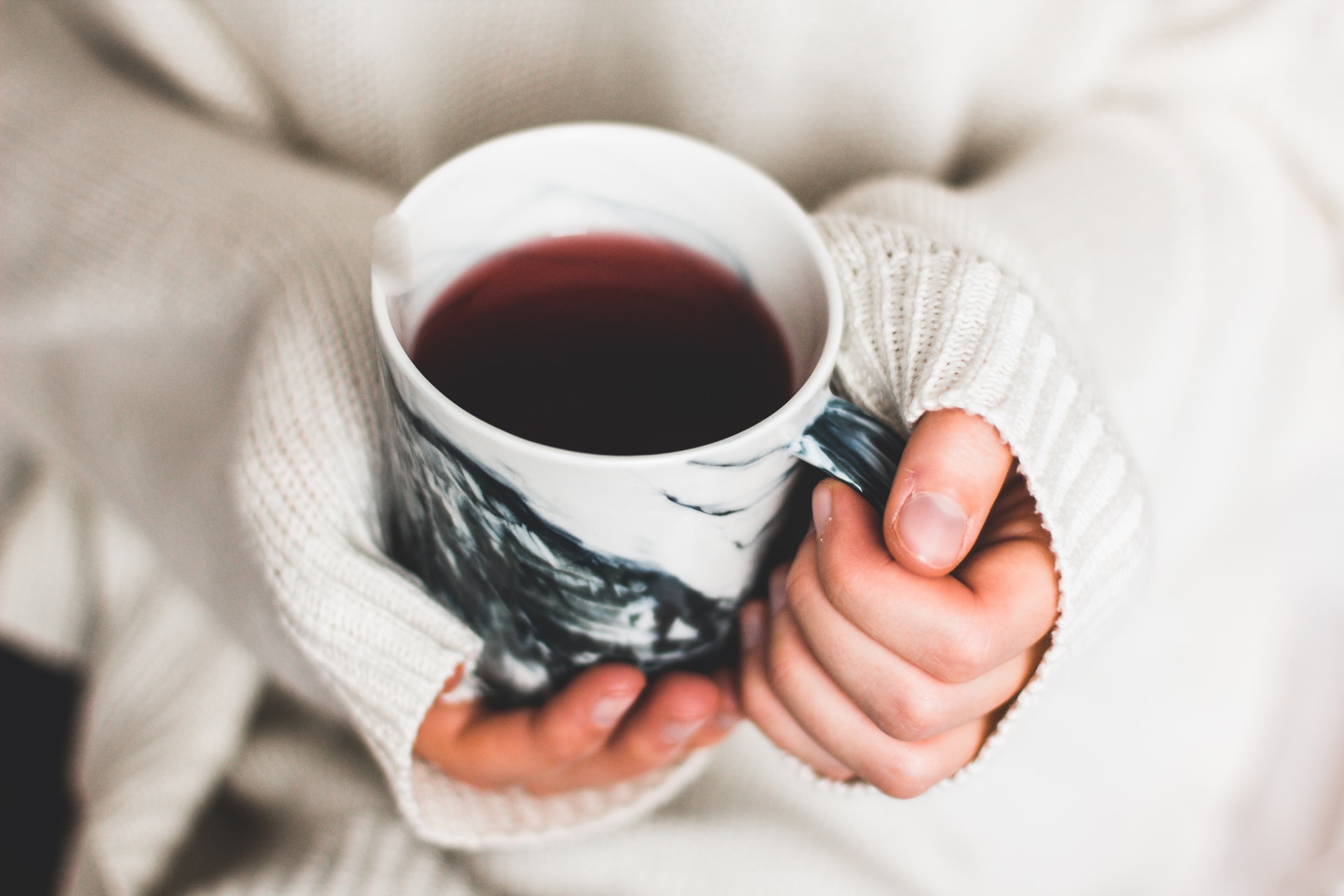 holding a cup of tea