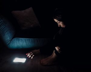 woman using smartphone at night