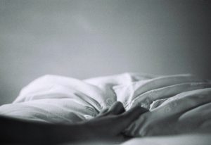 hand grasping blanket black and white