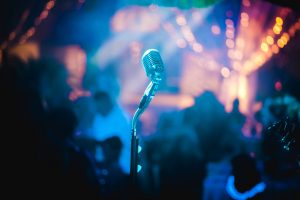 microphone in front of a crowded room