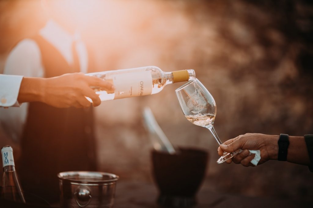 pouring wine into a glass