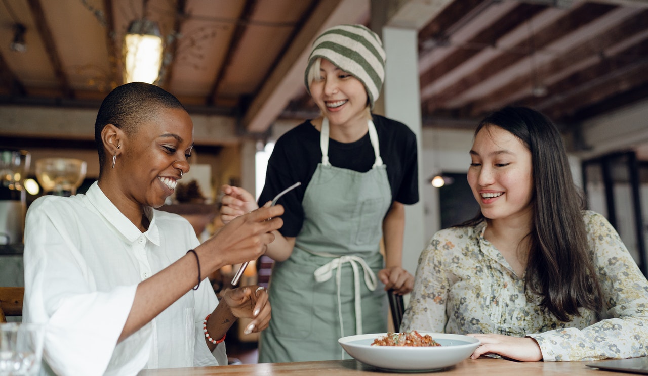 friends ordering food at restaurant