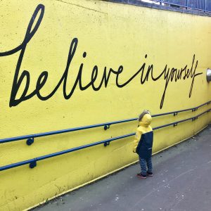 believe in yourself written on wall