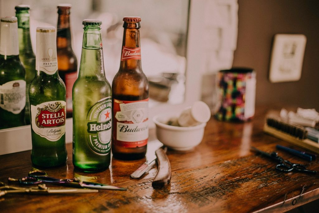 assorted beer bottles on a table