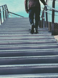 person climbing steps outdoors