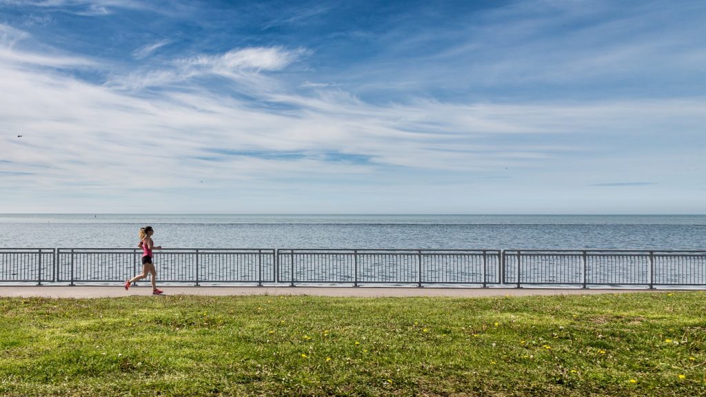 person running on the waterfront