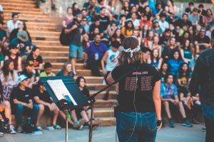 person speaking at an awareness-raising event