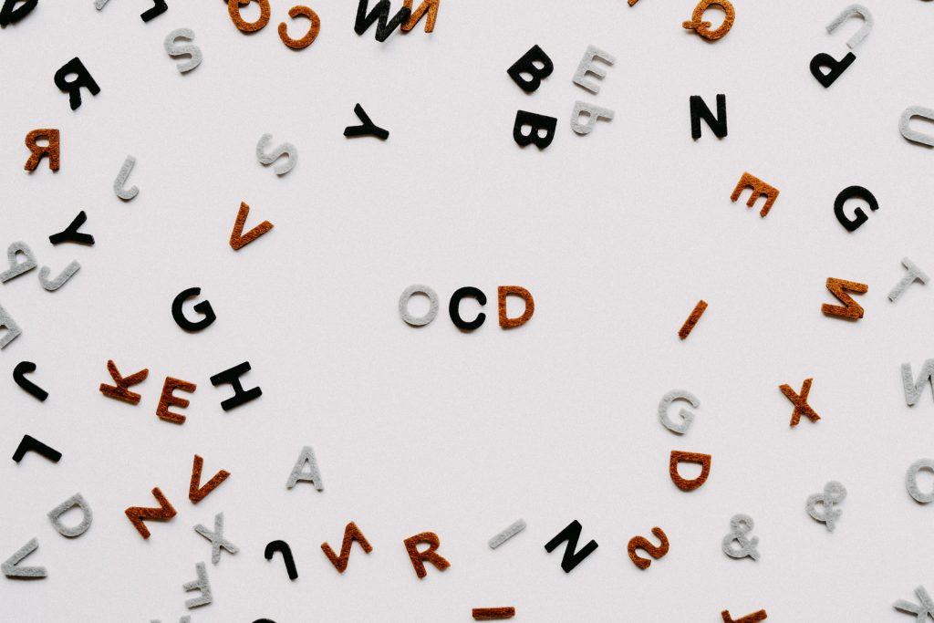 letters arranged on table spelling ocd