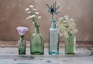 4 glass bottles reused as vases