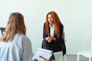 woman sitting in therapy session