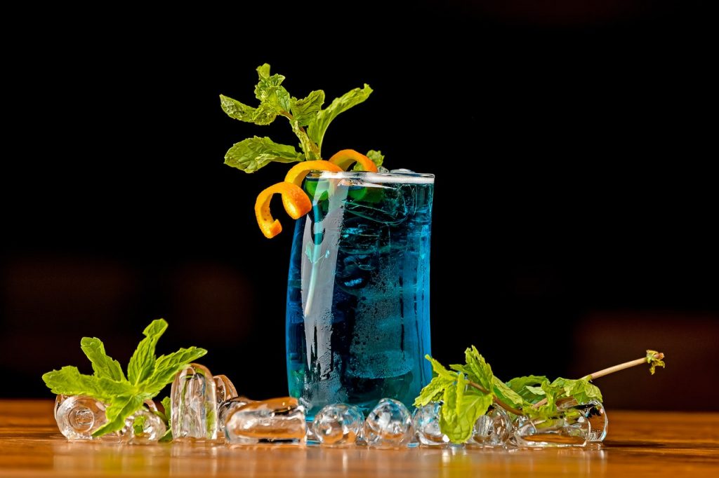 blue mocktail in glass on table